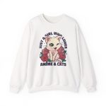 Front of the crewneck sweatshirt showing a winking pale cream cat framed by red roses and green leaves