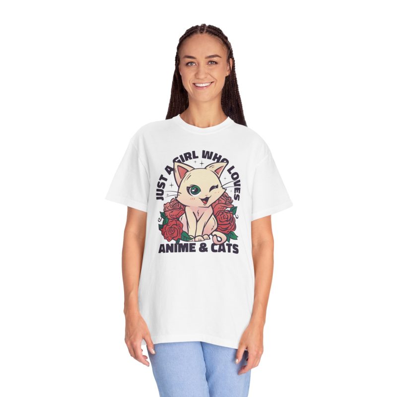 Person wearing a tee with a winking pale cream cat framed by red roses and green leaves printed on the front