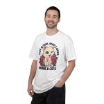 Person wearing a tee with a winking pale cream cat framed by red roses and green leaves printed on the front