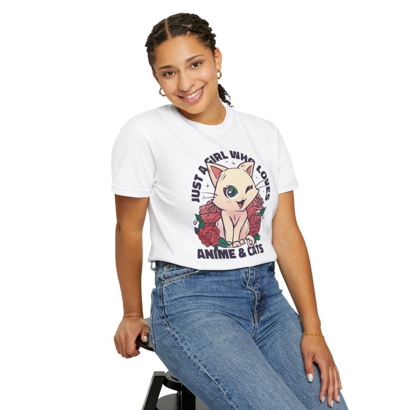 Person wearing a tee with a winking pale cream cat framed by red roses and green leaves printed on the front