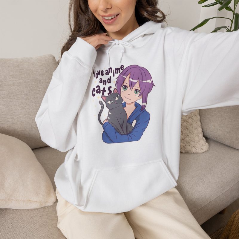 Person wearing a hoodie with a lilac-haired anime girl hugging a green-eyed gray cat printed on the front