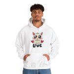 Person wearing a hoodie with a cream cat with glossy black eyes and red cheeks between two red hearts above black lettering printed on the front