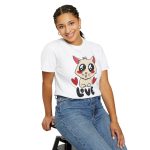 Person wearing a tee with a cream cat with glossy black eyes and red cheeks between two red hearts above black lettering printed on the front Person wearing a tee with a cream cat with glossy black eyes and red cheeks between two red hearts above black lettering printed on the front