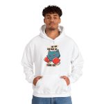 Person wearing a hoodie with a blue boxer cat with red gloves and a determined expression printed on the front Person wearing a hoodie with a blue boxer cat with red gloves and a determined expression printed on the front