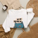 Blue boxer cat with red gloves and a determined expression and bold lettering in the front print