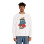 Person wearing a crewneck sweatshirt with a blue boxer cat with red gloves and a determined expression printed on the front