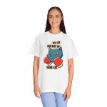 Person wearing a tee with a blue boxer cat with red gloves and a determined expression printed on the front Person wearing a tee with a blue boxer cat with red gloves and a determined expression printed on the front