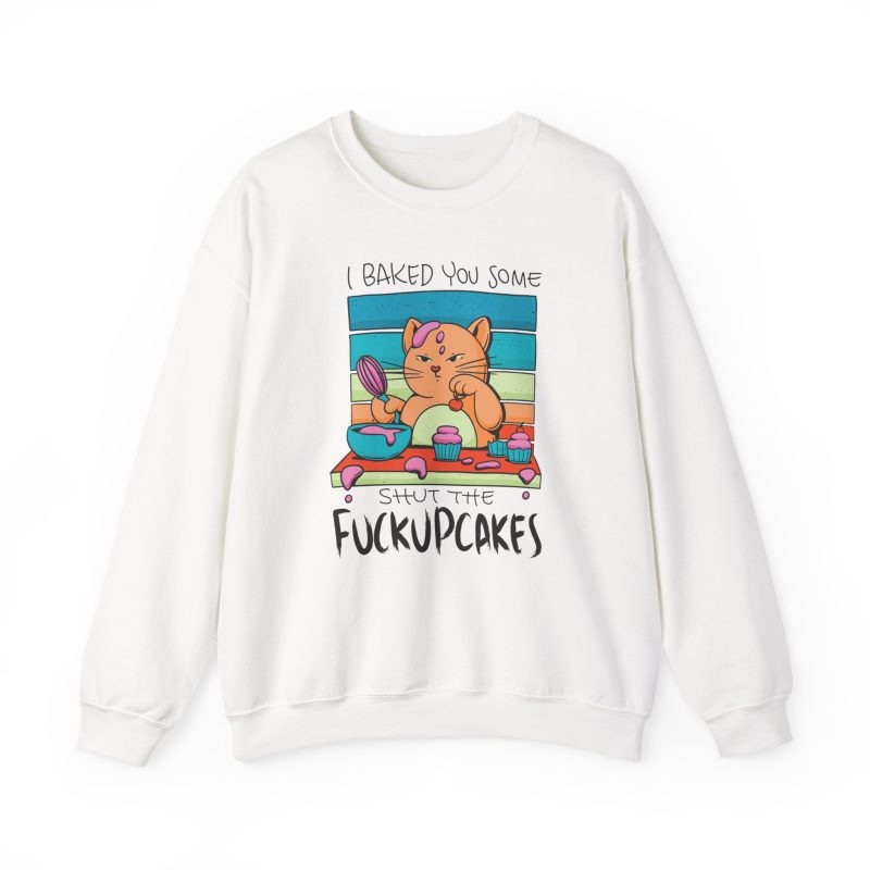 Front of the crewneck sweatshirt showing a ginger baker cat with a pink whisk, cupcakes and turquoise retro stripes