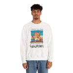Person wearing a crewneck sweatshirt with a ginger baker cat with a pink whisk, cupcakes and turquoise retro stripes printed on the front Person wearing a crewneck sweatshirt with a ginger baker cat with a pink whisk, cupcakes and turquoise retro stripes printed on the front