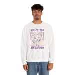 Person wearing a crewneck sweatshirt with a winking white cat drawn in blue inside a cream square with purple lettering printed on the front Person wearing a crewneck sweatshirt with a winking white cat drawn in blue inside a cream square with purple lettering printed on the front