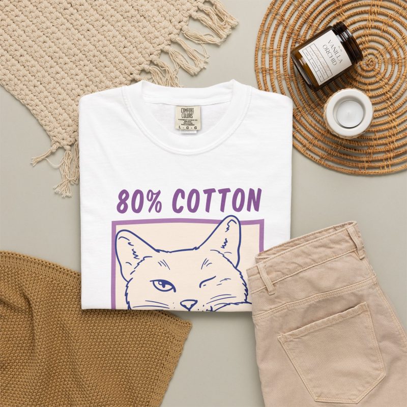 A winking white cat drawn in blue inside a cream square with purple lettering in the front print
