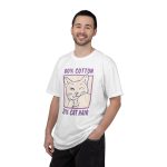 Person wearing a tee with a winking white cat drawn in blue inside a cream square with purple lettering printed on the front