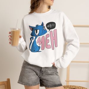 Person wearing a crewneck sweatshirt with an unimpressed blue cat beside large pink lettering and a black comic speech bubble printed on the front