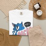 An unimpressed blue cat beside large pink lettering and a black comic speech bubble in the front print