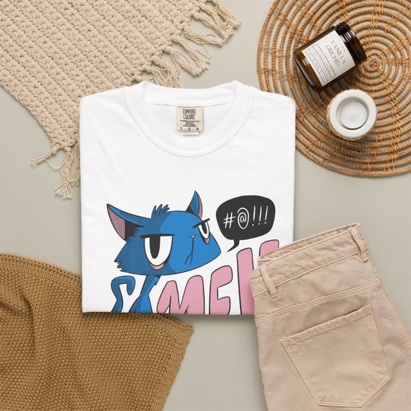 An unimpressed blue cat beside large pink lettering and a black comic speech bubble in the front print