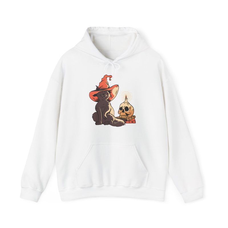 Front of the hoodie showing a brown cat in an orange witch hat beside a skull, lit candle and stacked spell books