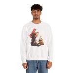 Person wearing a crewneck sweatshirt with a brown cat in an orange witch hat beside a skull, lit candle and stacked spell books printed on the front