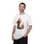 Person wearing a tee with a brown cat in an orange witch hat beside a skull, lit candle and stacked spell books printed on the front