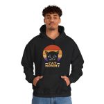 Person wearing a hoodie with a cat face inside red, orange and purple sunset stripes above warm orange lettering printed on the front