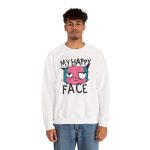 Person wearing a crewneck sweatshirt showing a pink and teal cat face and black lettering on the front