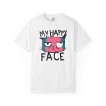 Front of the tee showing a pink and teal cat face and black lettering