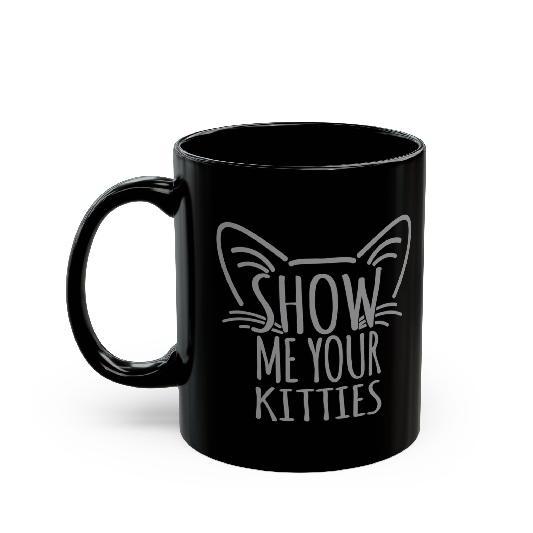 Glossy black ceramic mug showing gray cat-ear and whisker lettering