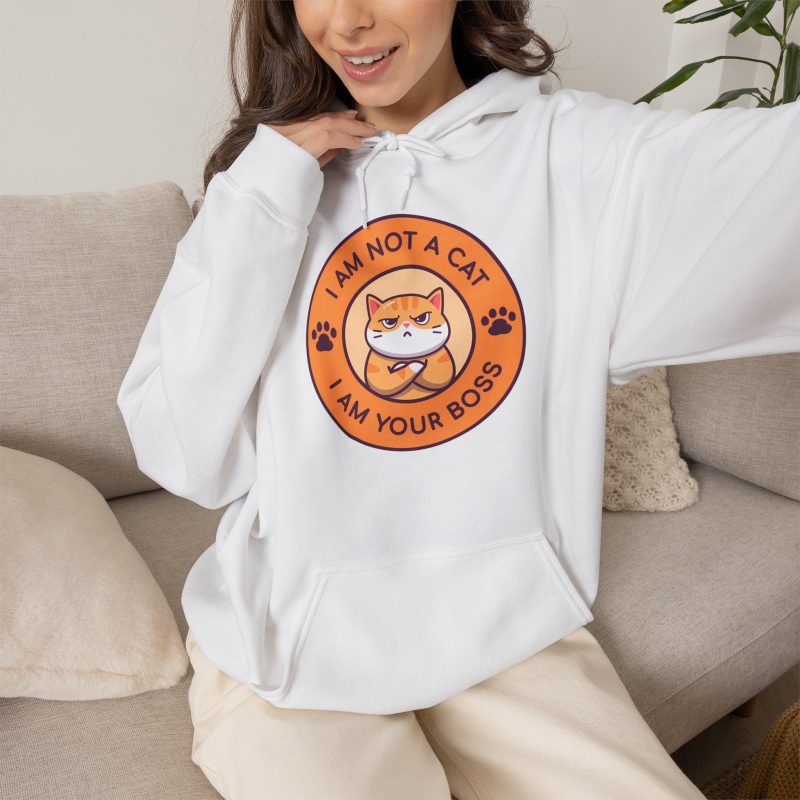 Person wearing a hoodie with an unimpressed ginger tabby with crossed arms inside an orange badge with dark purple lettering and two paw prints printed on the front