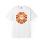Front of the tee showing an unimpressed ginger tabby with crossed arms inside an orange badge with dark purple lettering and two paw prints Front of the tee showing an unimpressed ginger tabby with crossed arms inside an orange badge with dark purple lettering and two paw prints
