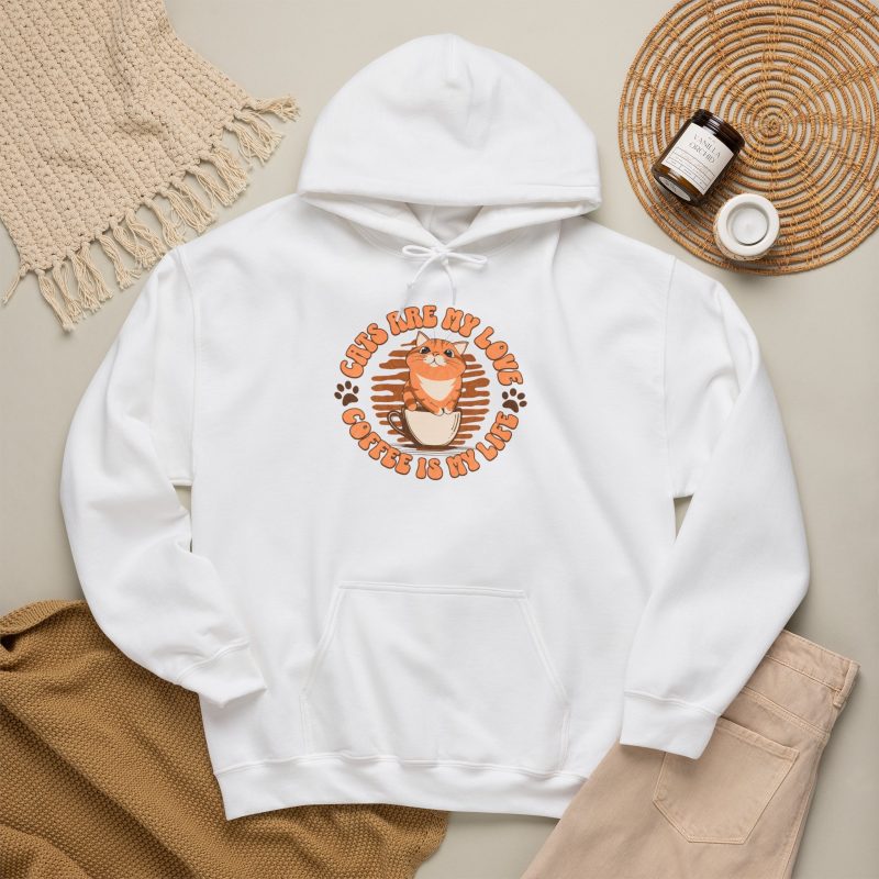 Detail of the hoodie's orange tabby in a cream coffee cup, paw prints and circular lettering
