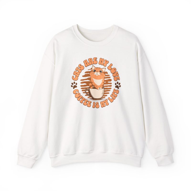 Front of a white cat sweatshirt with an orange tabby in a coffee cup and paw prints