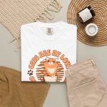 Orange tabby in a cream coffee cup with paw prints and Cats Are My Love, Coffee Is My Life lettering