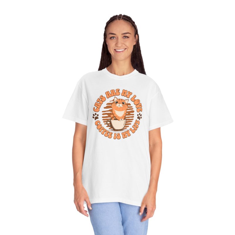 Person wearing a white tee with an orange tabby in a coffee cup printed on the front