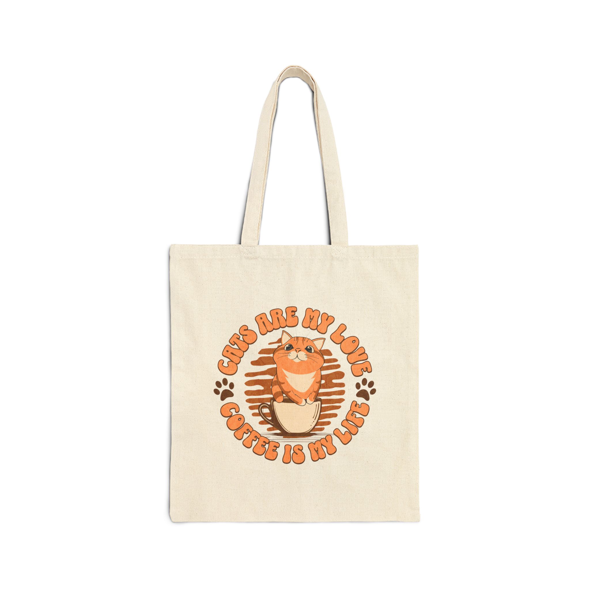 Front of a natural cotton canvas cat tote bag with an orange tabby in a coffee cup