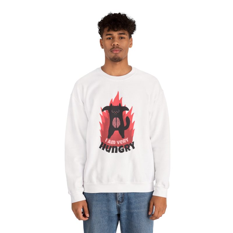 Person wearing a sweatshirt with a hungry black cat and pink flames