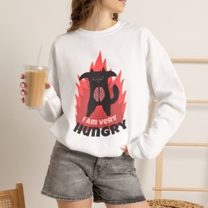 Person wearing a sweatshirt with a hungry black cat and pink flames