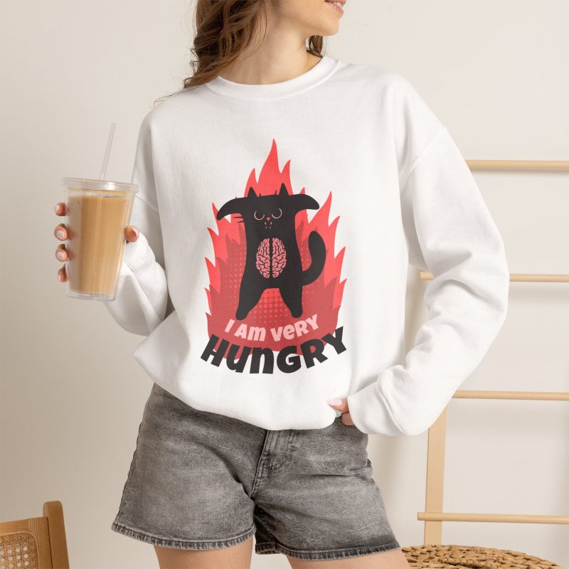 Person wearing a sweatshirt with a hungry black cat and pink flames
