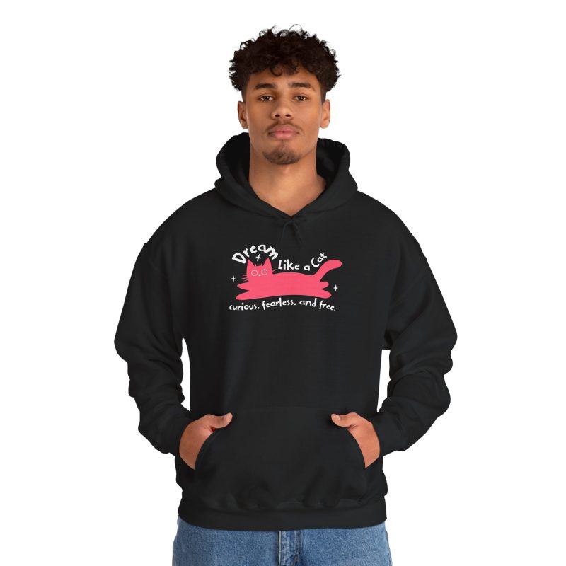 Person wearing a hoodie with a pink reclining cat with a raised tail, round eyes and white sparkles printed on the front