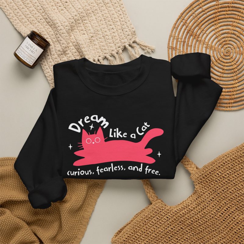 Pink reclining cat, white sparkles and curved Dream Like a Cat lettering in the front print