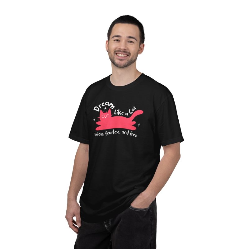 Person wearing a tee with a pink reclining cat with a raised tail, round eyes and white sparkles printed on the front
