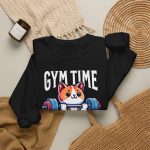 Wide-eyed kitten with a barbell, tank top and lifting belt beneath Gym Time lettering in the front print