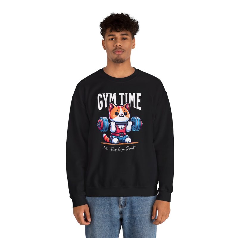 Person wearing a crewneck sweatshirt with an orange-and-white kitten lifting a barbell with blue and pink weight plates printed on the front