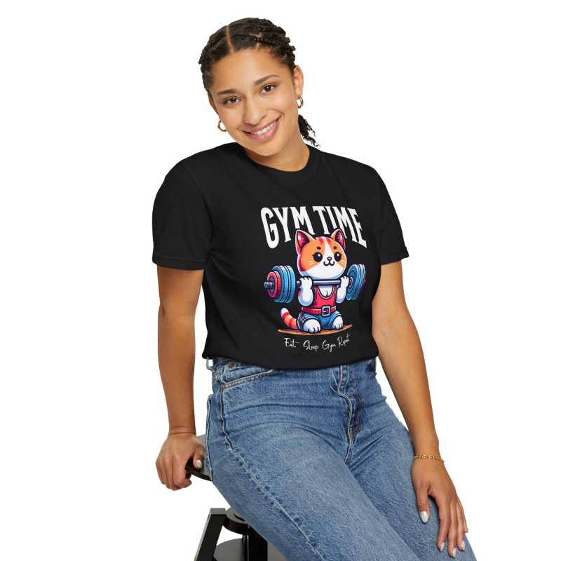 Person wearing a tee with an orange-and-white kitten lifting a barbell with blue and pink weight plates printed on the front