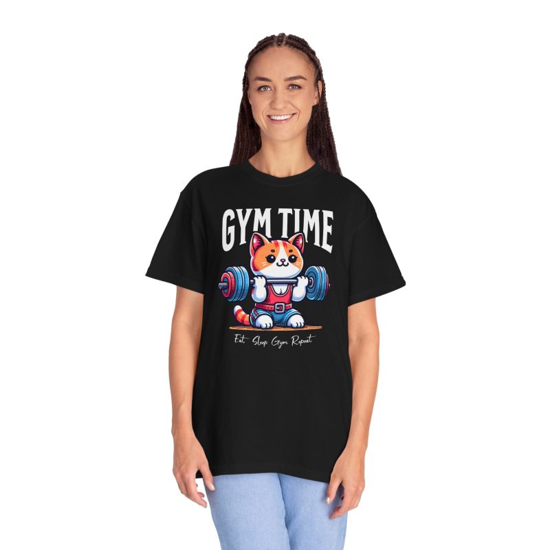 Person wearing a tee with an orange-and-white kitten lifting a barbell with blue and pink weight plates printed on the front