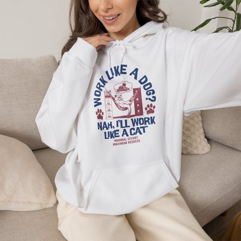 Person wearing a hoodie with a cat reclining in a hammock between filing cabinets with blue lettering and red paw prints printed on the front