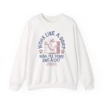 Front of the crewneck sweatshirt showing a cat reclining in a hammock between filing cabinets with blue lettering and red paw prints
