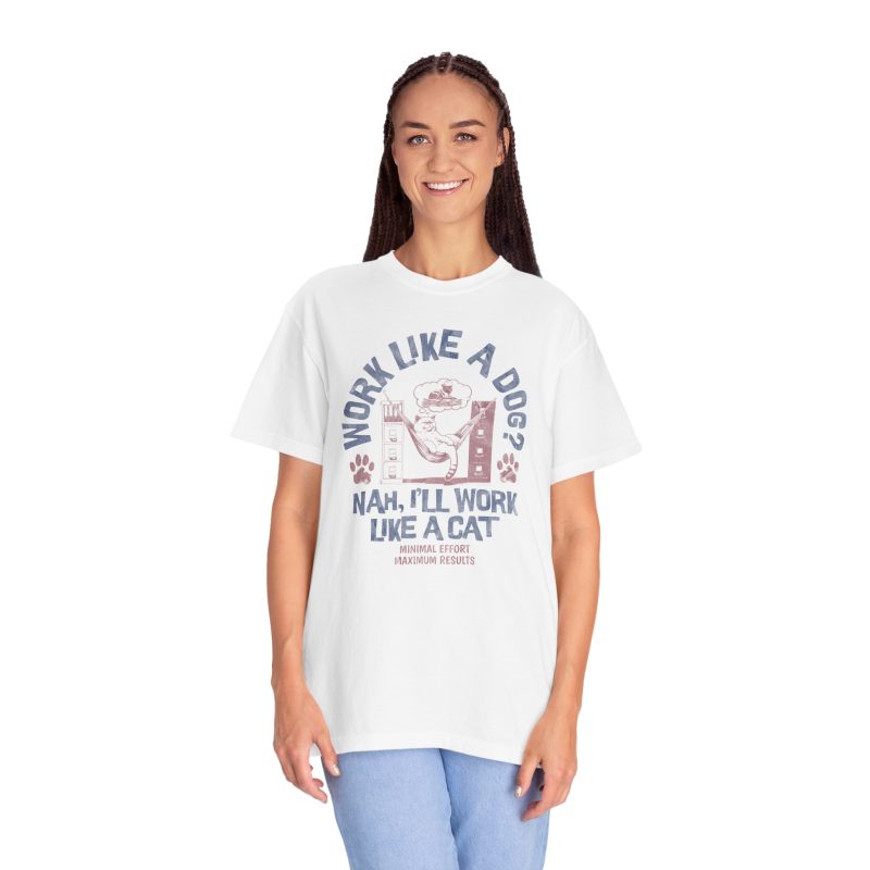 Person wearing a tee with a cat reclining in a hammock between filing cabinets with blue lettering and red paw prints printed on the front
