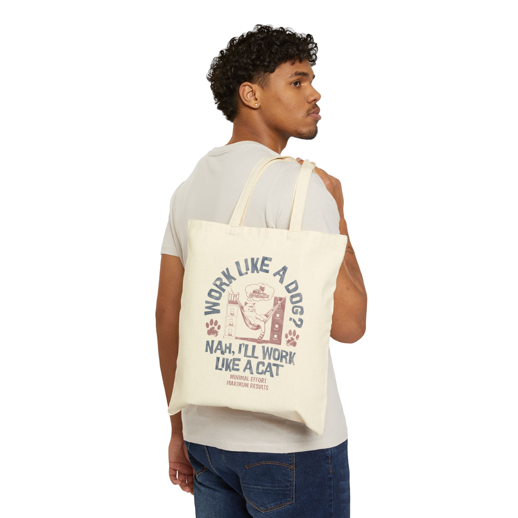 Person carrying a natural canvas tote with a cat reclining in a hammock between filing cabinets with blue lettering and red paw prints facing outward
