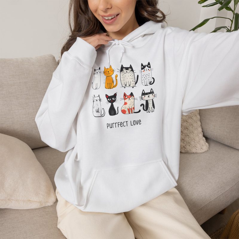 Person wearing a hoodie with eight line-drawn cats in two rows with different expressions and coat patterns printed on the front