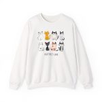 Front of the crewneck sweatshirt showing eight line-drawn cats in two rows with different expressions and coat patterns