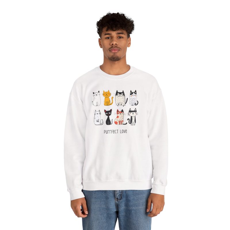 Person wearing a crewneck sweatshirt with eight line-drawn cats in two rows with different expressions and coat patterns printed on the front